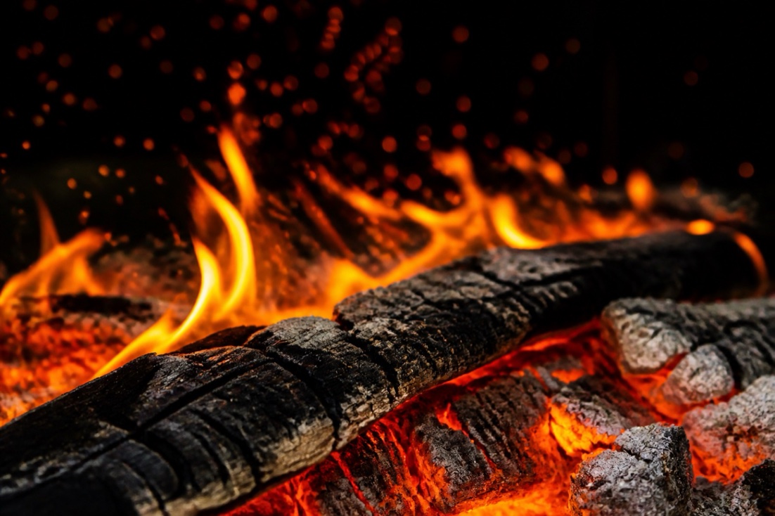 The wood fire, still burning